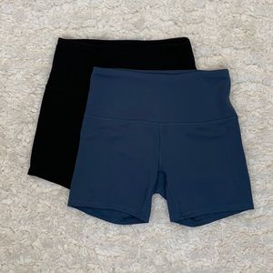 Black and teal RBX spandex shorts, size small